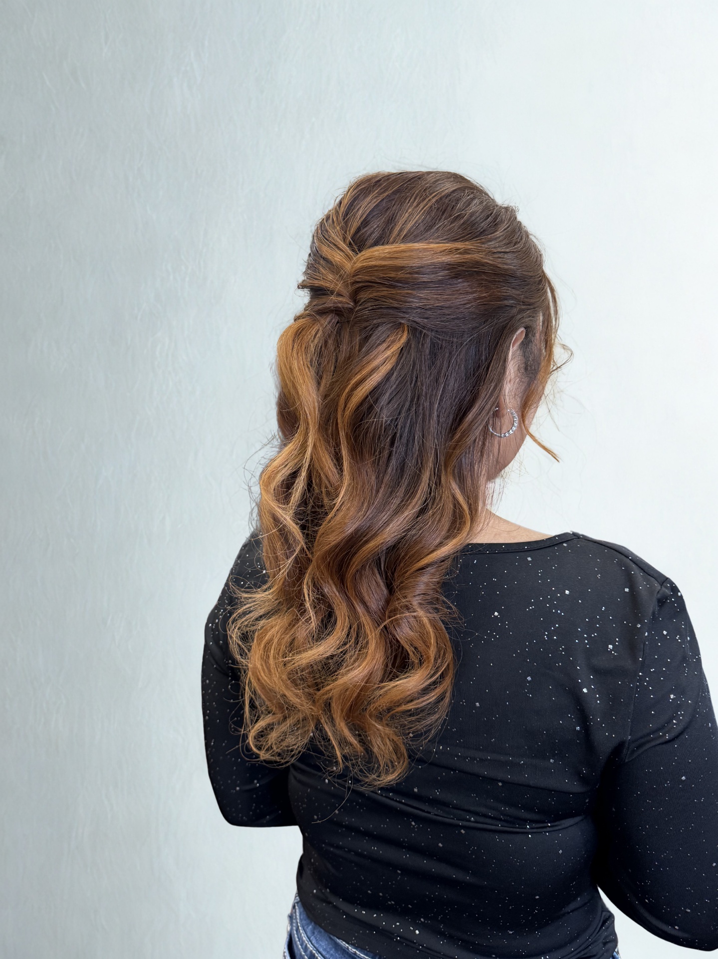 Real client — half-up style with soft curls and caramel balayage